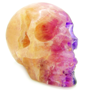 Calcite crystal skull with purple and blue fluorite